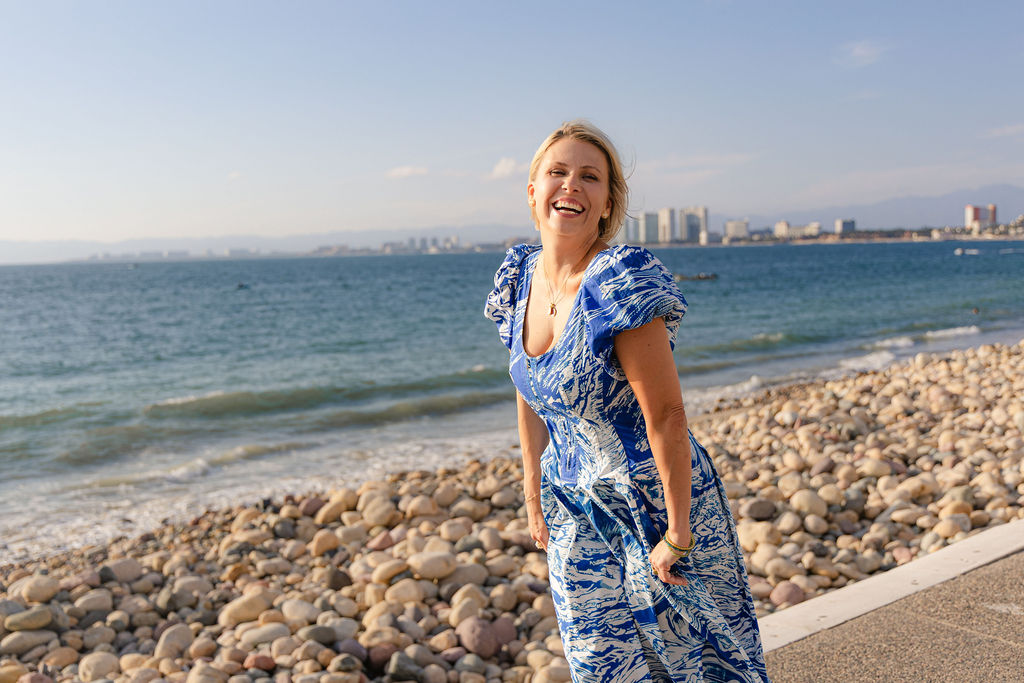 Laci on the beach in Puerto Vallarta researching expat life in Mexico